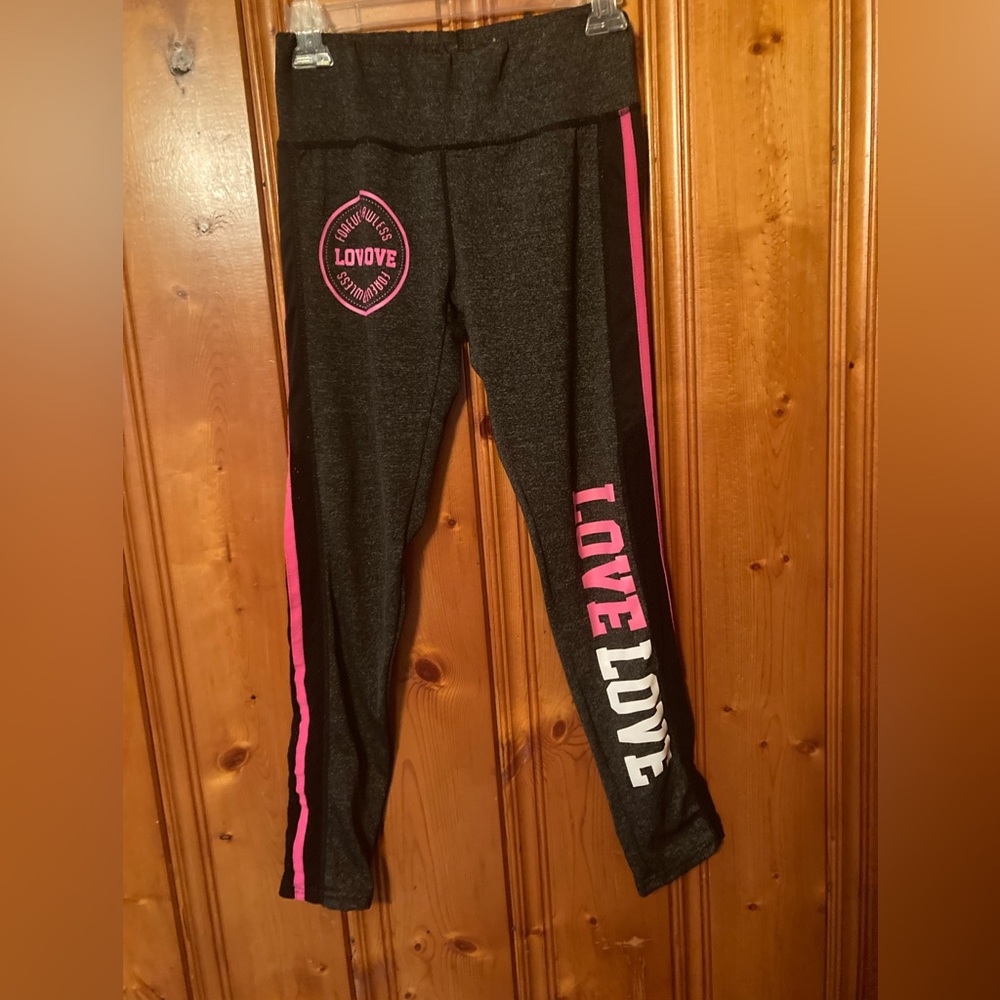 Size Medium Women’s performance  leggings perforated on sides from knees down